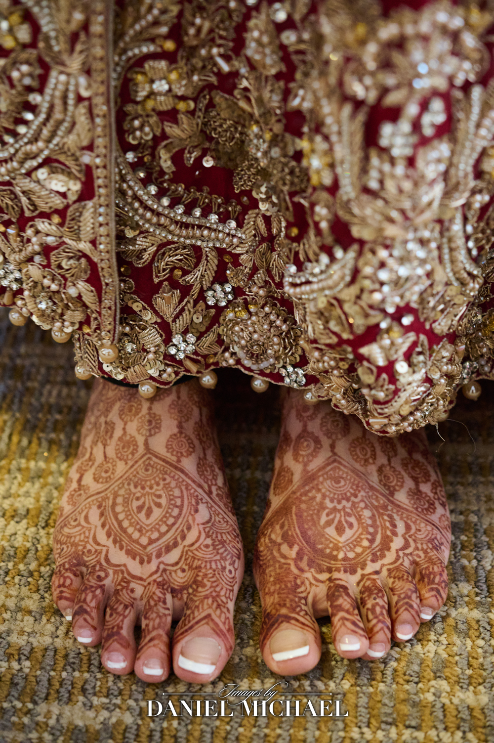 Close-up of traditional henna art on a bride's feet at a South Asian wedding